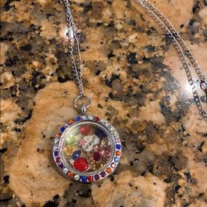 Locket style necklace with charms